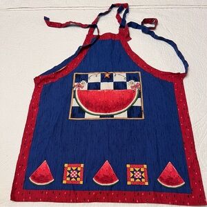 This is a vintage folk cottage style watermelon apron in red, white, and blue